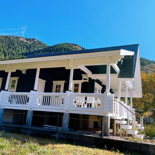 a house with a porch and a white railing at 'OLI' OLI tree - Vacation STAY 39608v in Takashima