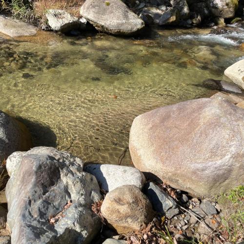 a stream of water with rocks in the foreground at 'OLI' OLI tree - Vacation STAY 39608v in Takashima