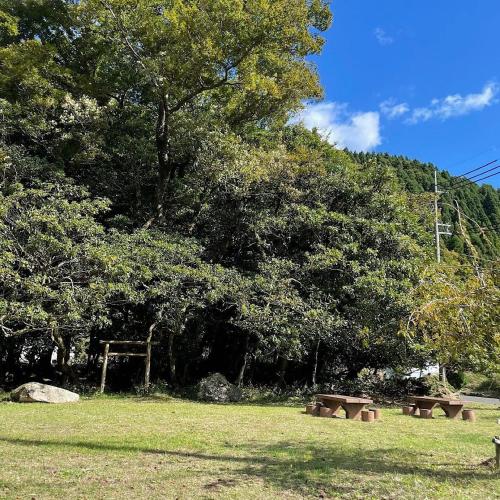 a group of benches in a park with trees at 'OLI' OLI tree - Vacation STAY 39608v in Takashima