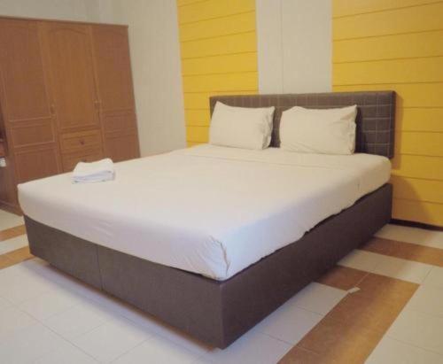 Una cama o camas en una habitación de Kumkaew Udon