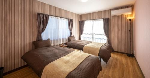 Postel nebo postele na pokoji v ubytování VILLENT Kujukuri Marine - Vacation STAY 44476v