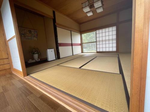 a large room with a large mat on the floor at Ariki Resort Shuzenji - Vacation STAY 52314v in Izu