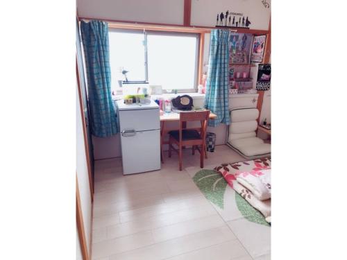 a kitchen and dining room with a table and a window at Komorebi no Ie - Vacation STAY 58225v in Uji
