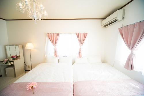 a bedroom with two beds and a window at Yokkaichi - House - Vacation STAY 14171 in Yokkaichi