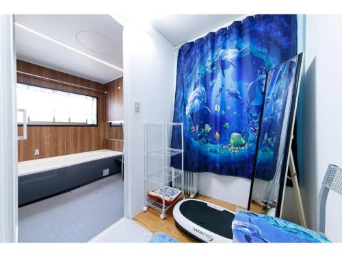 a bathroom with a large painting on the wall at Oasis Wadaura - Vacation STAY 85732v in Kamogawa