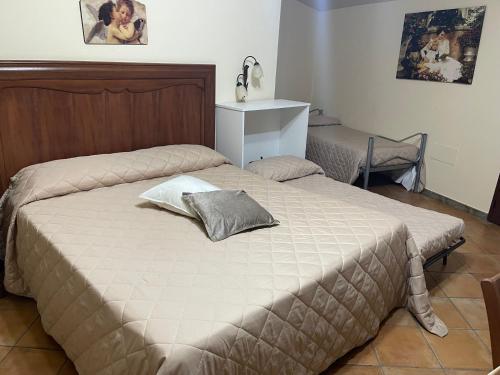 a bedroom with a bed with a pillow on it at B&B Marchese SantAndrea in Licata