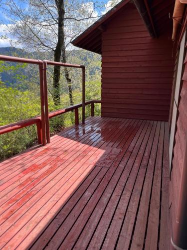 a wooden porch of a cabin with a wooden deck at Jomine Koen Campjo - Vacation STAY 85267v in Minano
