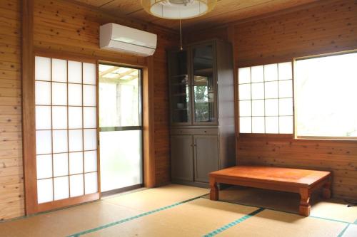 a room with a door and a bench in it at Washinosu Campground - Vacation STAY 85295v in Motegi