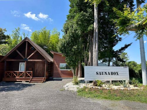 a sign in front of a cabin with a sign that reads santa cabin at Otomie Log House - Vacation STAY 69826v in Kimitsu