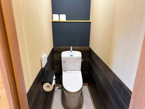 a bathroom with a white toilet in a room at Otomie Log House - Vacation STAY 69826v in Kimitsu