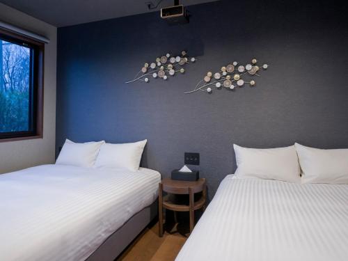 Giường trong phòng chung tại Rakuten STAY VILLA Yatsugatake - 102 Stylish Design -