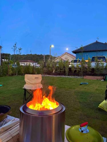 a pot on fire with a hat on top of it at Turf and Surf Taito Beach - Vacation STAY 76598v in Isumi