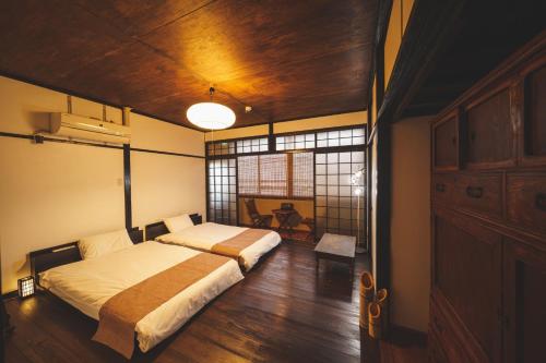 En eller flere senge i et værelse på YOTTE - Vacation STAY 14234