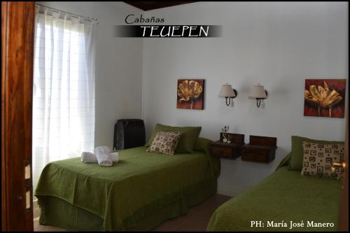 a bedroom with two beds and a sign that reads telegram at Cabañas Teuepen in El Calafate