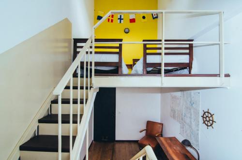 a room with a staircase with a bunk bed at La Joya Hostel in Valparaíso