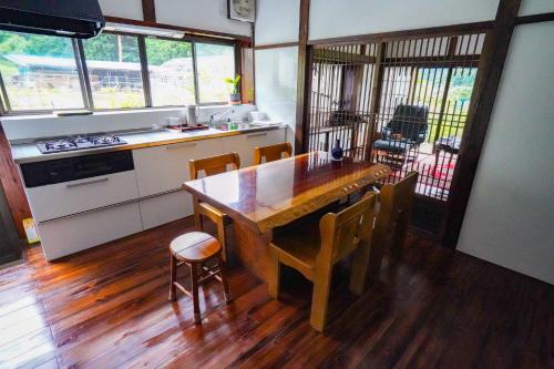 a kitchen with a wooden table and some chairs at Mitsutoge no Yado - Vacation STAY 14305 in Nishikatsuracho