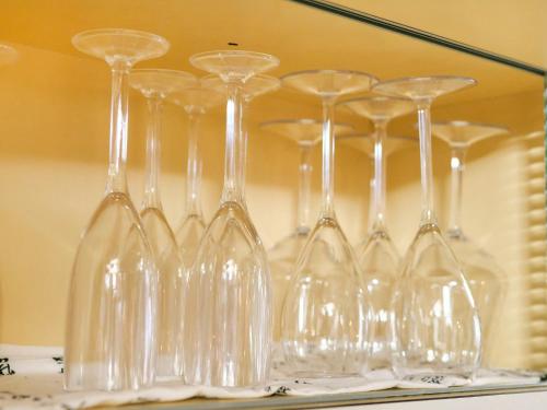 a group of wine glasses in front of a mirror at Kokoyui Guest House Shingu - Vacation STAY 03207v in Shingu