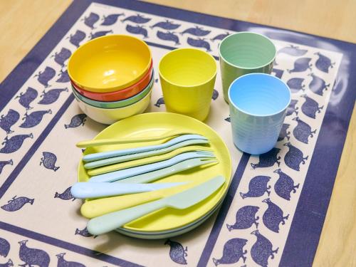 a table with plates and cups on a table at Kokoyui Guest House Shingu - Vacation STAY 03207v in Shingu