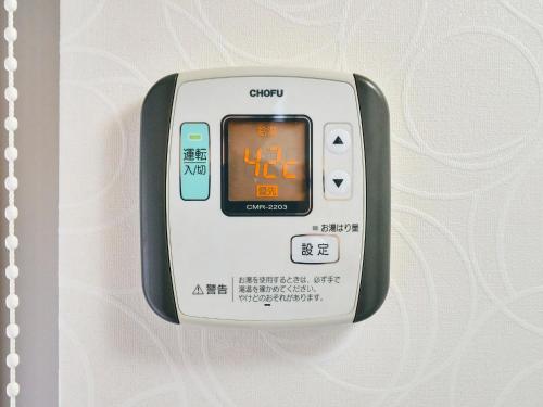 an electronic device is attached to a wall at Kokoyui Guest House Shingu - Vacation STAY 03207v in Shingu