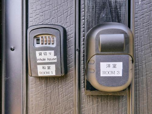 a metal door with a parking meter on it at Kokoyui Guest House Shingu - Vacation STAY 03207v in Shingu