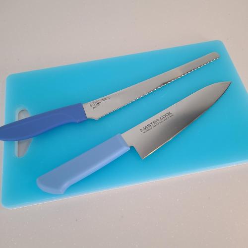 a knife sitting on top of a blue cutting board at Fluctus - Vacation STAY 16974v in Hitachi