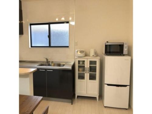 Кухня или мини-кухня в Sunset Village - Vacation STAY 15318v
