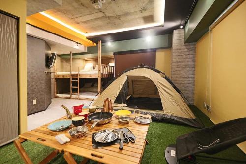 a room with a tent and a table with food at Lions Mansion Sanbankan Room 506 - Vacation STAY 14364 in Jozankei