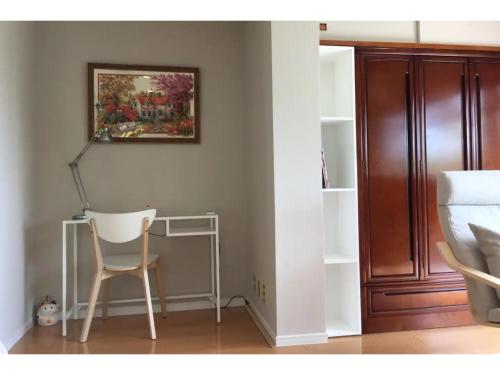 a chair in a room with a picture on the wall at Masaya Villa - Vacation STAY 23215v in Ito