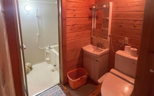 a bathroom with a toilet and a shower and a sink at village yumigahama - Vacation STAY 49352v in Minato
