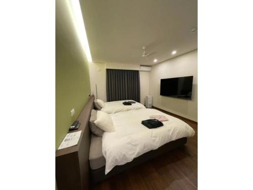 Katil atau katil-katil dalam bilik di LeaLea Resort Villa Kamoike - Vacation STAY 16761