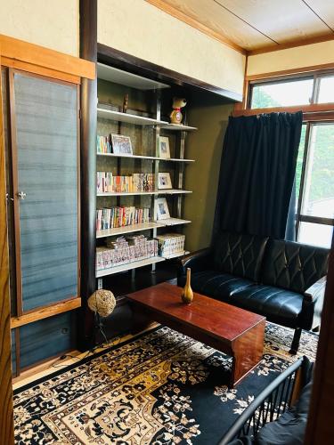 a living room with a couch and a table at Tenya - Vacation STAY 34204v in Kami Amakusa