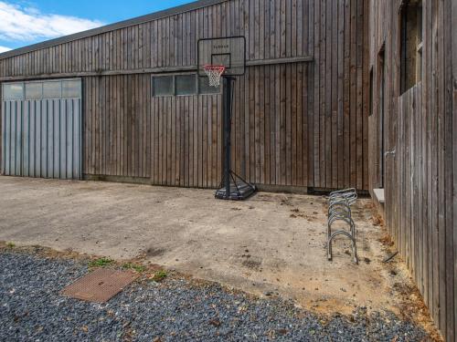 a basketball hoop in front of a building at Luxurious house with sauna in Bastogne in Bastogne