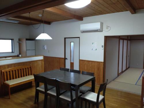 a dining room with a table and chairs at Tentengo Shibu River - Vacation STAY 70145v in Ono