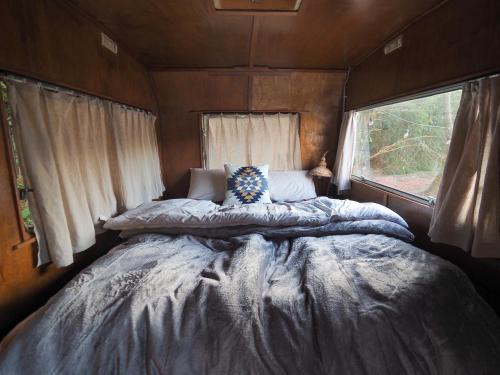 a bedroom with a large bed in a trailer at NAT PARK - Camp - Vacation STAY 42069v in Iwada