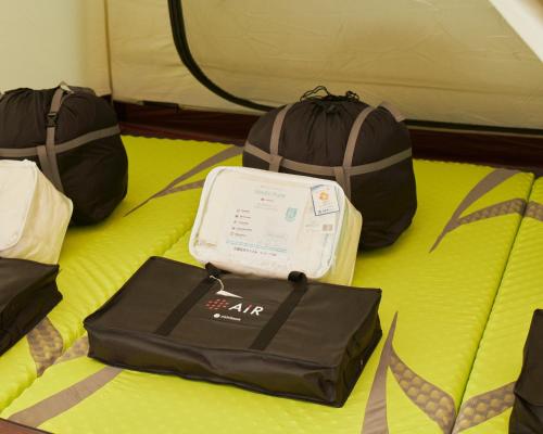 a bed with three bags on top of it at Kinoene SAKE CAMP - Camp - Vacation STAY 42047v in Shisui