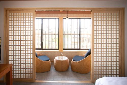 a room with a window with chairs and a table at Nagi - Vacation STAY 55367v in Katori