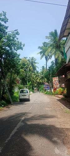 a car parked on the side of a street at selfia guest house in Majorda