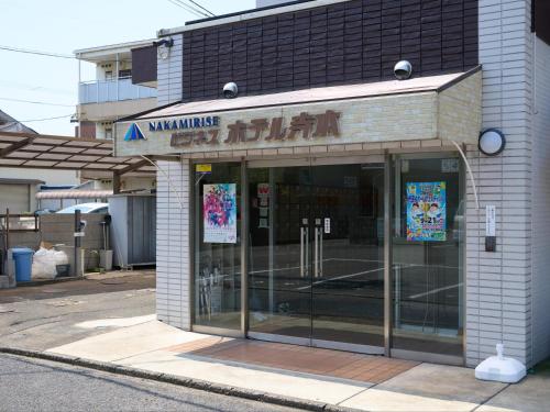 a store front of a building with glass doors at Tabist Business Hotel Teramoto in Chita