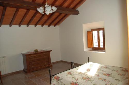 Postel nebo postele na pokoji v ubytování Agriturismo Casapasserini