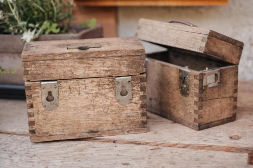a couple of boxes sitting on top of a table at Pimont Alpine Chalet in Madonna di Campiglio