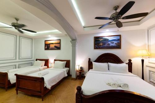 Postel nebo postele na pokoji v ubytování Mylaohome Guesthouse & Spa