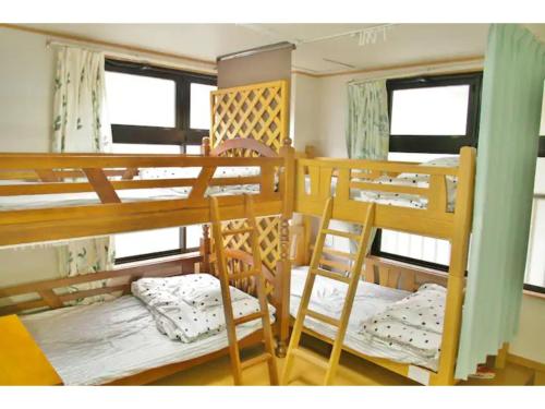 Кровать или кровати в номере Okusuruga Guest House - Vacation STAY 14699