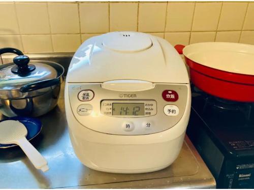 a mixer sitting on a counter next to a pot at Minpaku Yagi - Vacation STAY 14700 in Ise