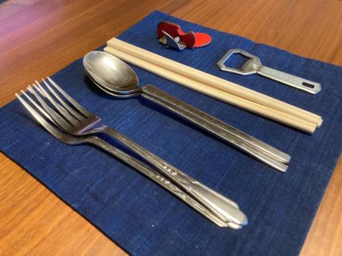 a group of utensils sitting on a blue napkin at Minpaku Yagi - Vacation STAY 14700 in Ise