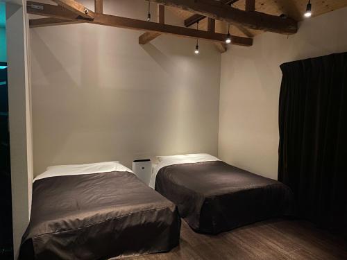Ένα ή περισσότερα κρεβάτια σε δωμάτιο στο Ocean Resort Tateyama K House - Vacation STAY 73446v