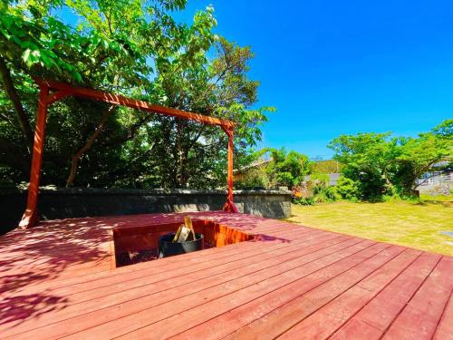 a wooden deck with a fire pit on top of it at Takabayashi Shoten Liquor store where you can stay - Vacation STAY 69075v in Oshima