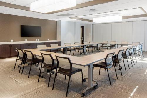 a large conference room with a long table and chairs at Cambria Hotel College Park in College Park