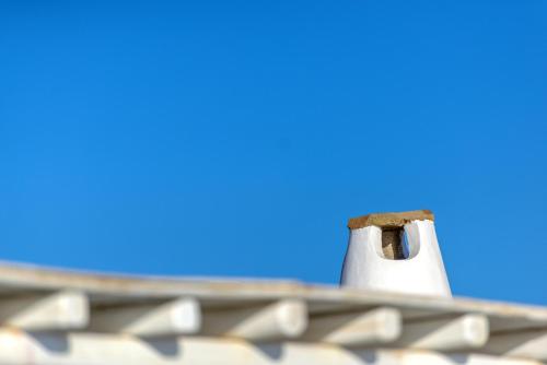 a mortar and pestle on top of a table at Sunset Villa in Houlakia