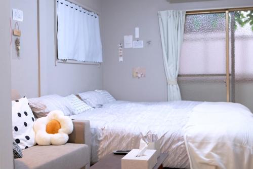 Postel nebo postele na pokoji v ubytování Daiichi Mitsumi Corporation - Vacation STAY 14790