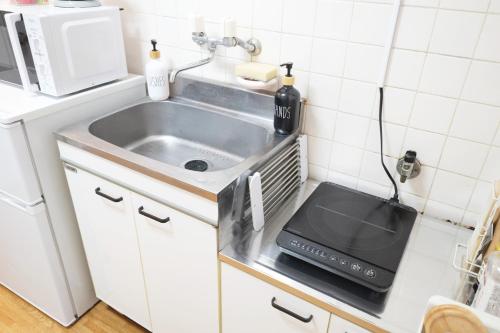 Kuchyň nebo kuchyňský kout v ubytování Daiichi Mitsumi Corporation - Vacation STAY 14790